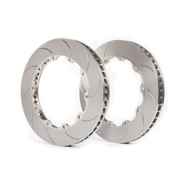 Two metallic brake rotors on a white background